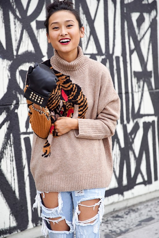 michelle-forstadt-top-knot-bun-hm-tiger-sweater-ripped-jeans